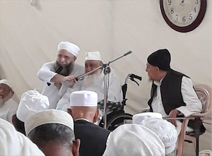 Haji Abdul Wahab Speaking with an Intepreto